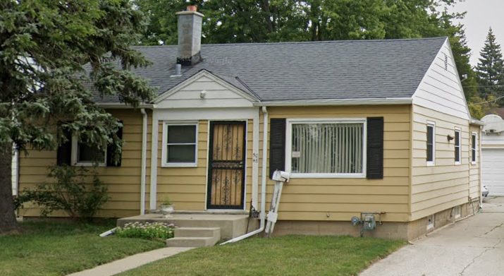 Before photo of a yellow house