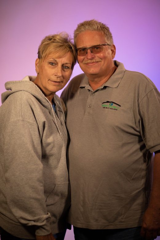 A man and a woman are posing for a picture together.