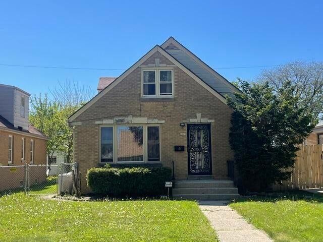 Front exterior of a brick bungalow after renovation